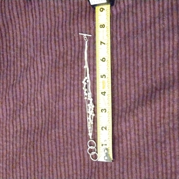 Silver adjustable toggle bracelets with silver balls on. - Picture 2 of 2
